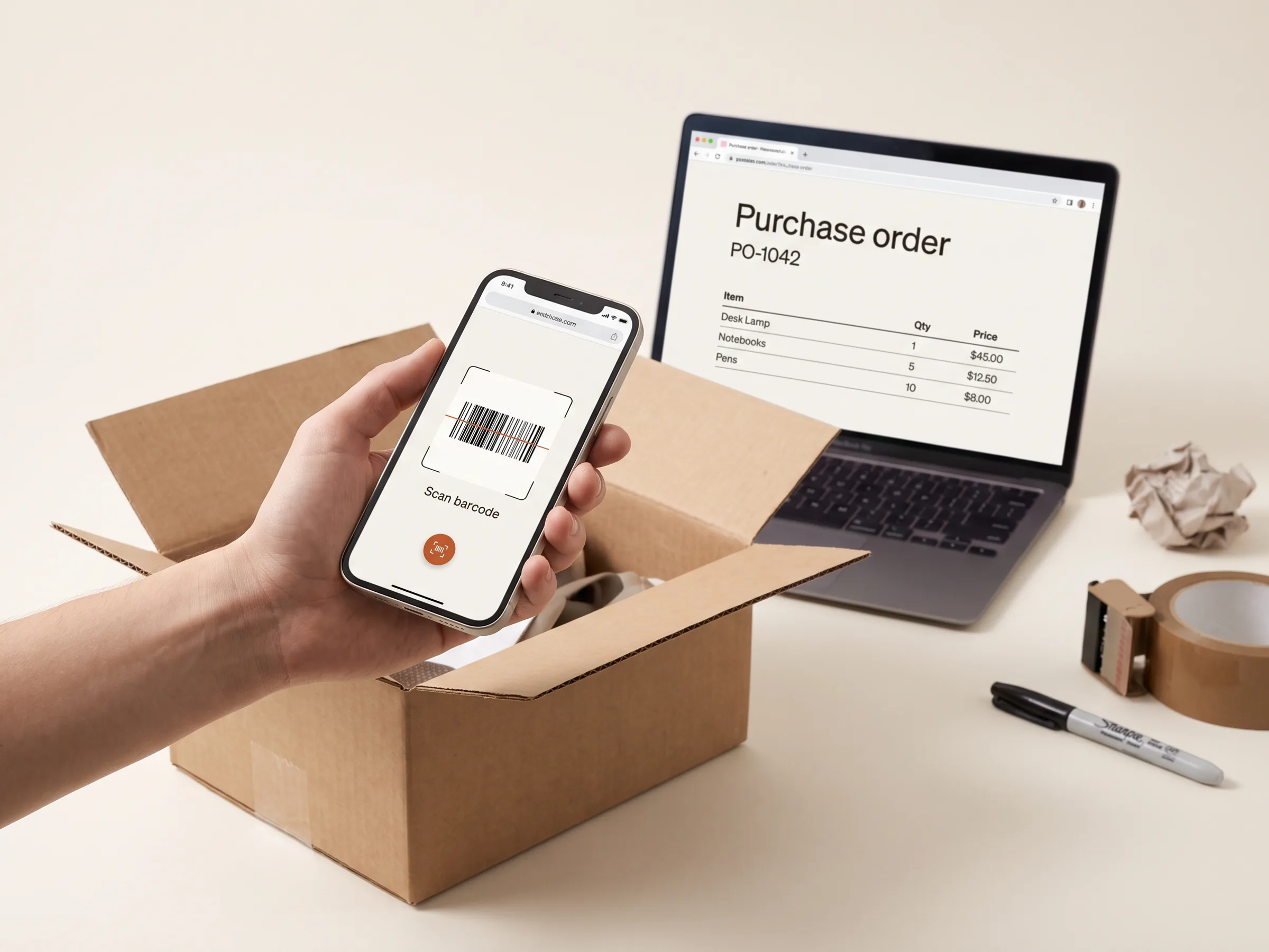 A phone scanning a carton barcode in front of a laptop showing a purchase order