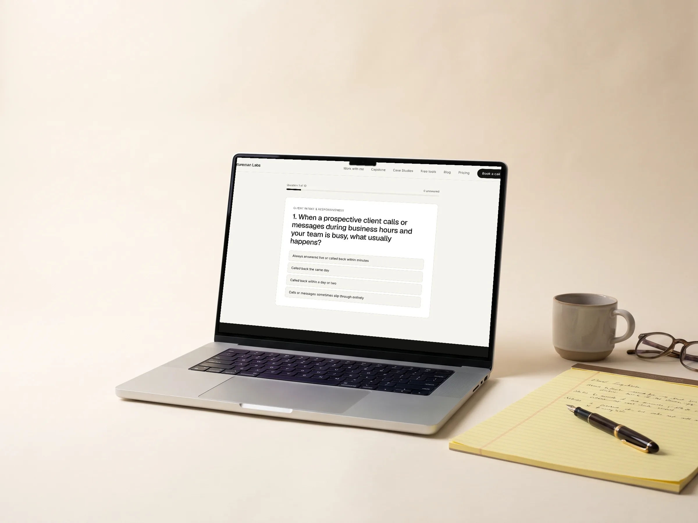 A laptop on a law office desk showing a readiness scorecard, beside a legal pad